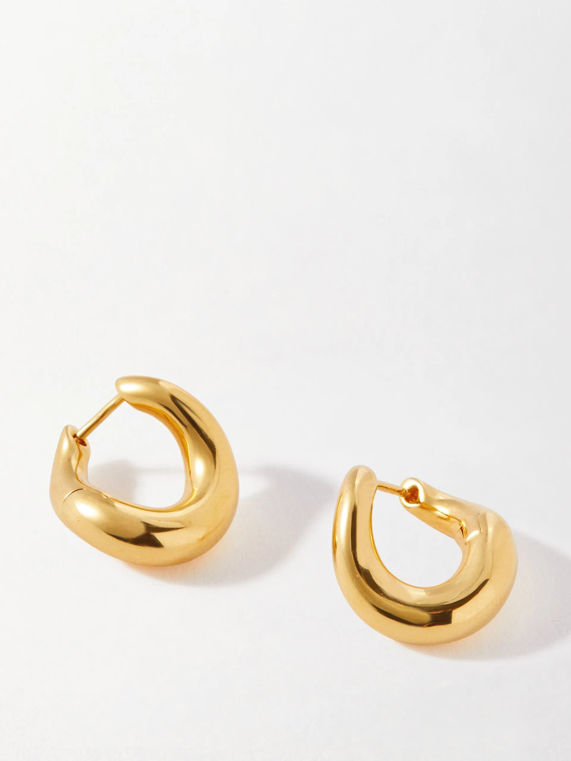 Charlotte Collins twist hoop earrings in gold