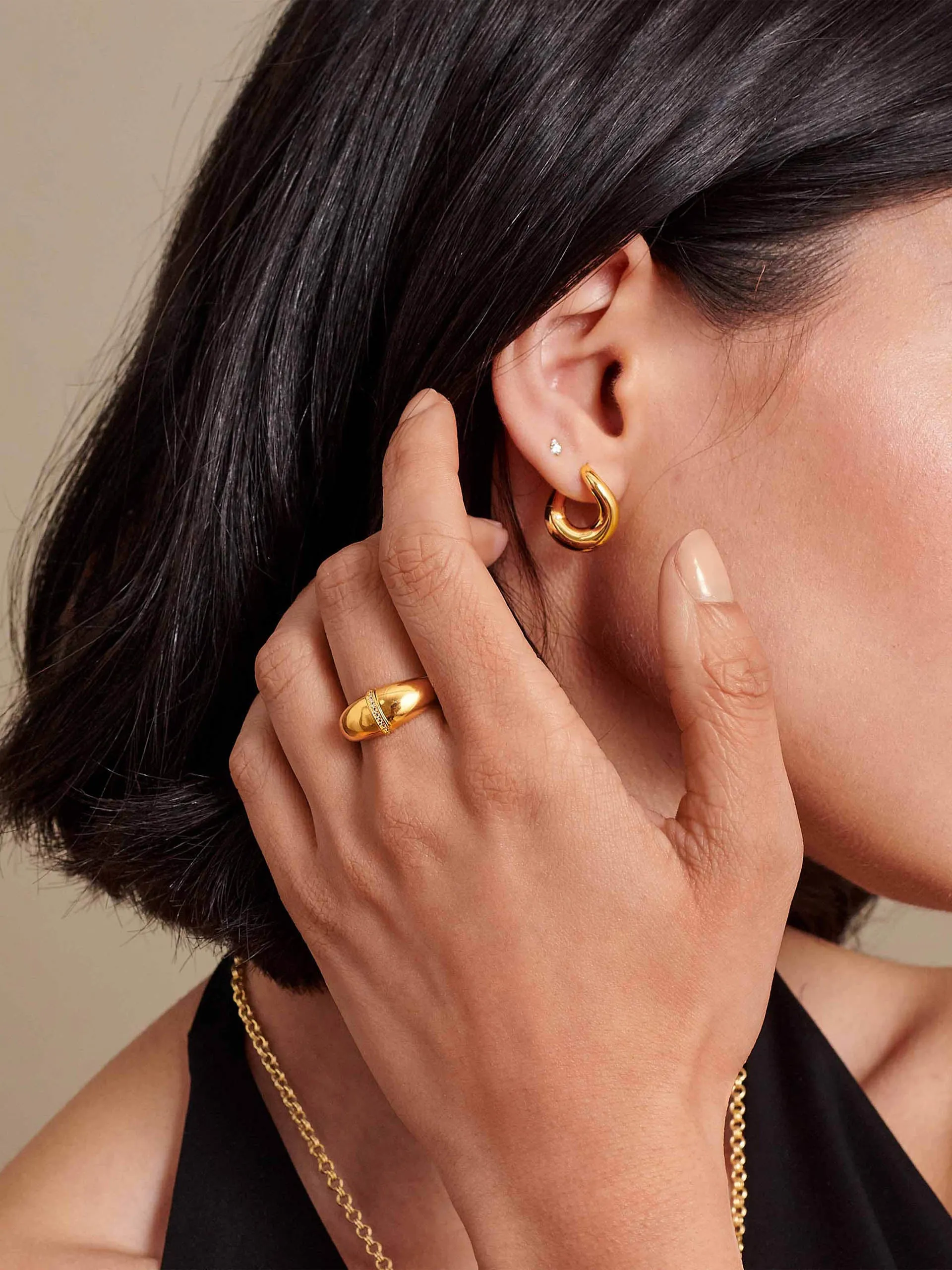 Charlotte Collins twist hoop earrings in gold