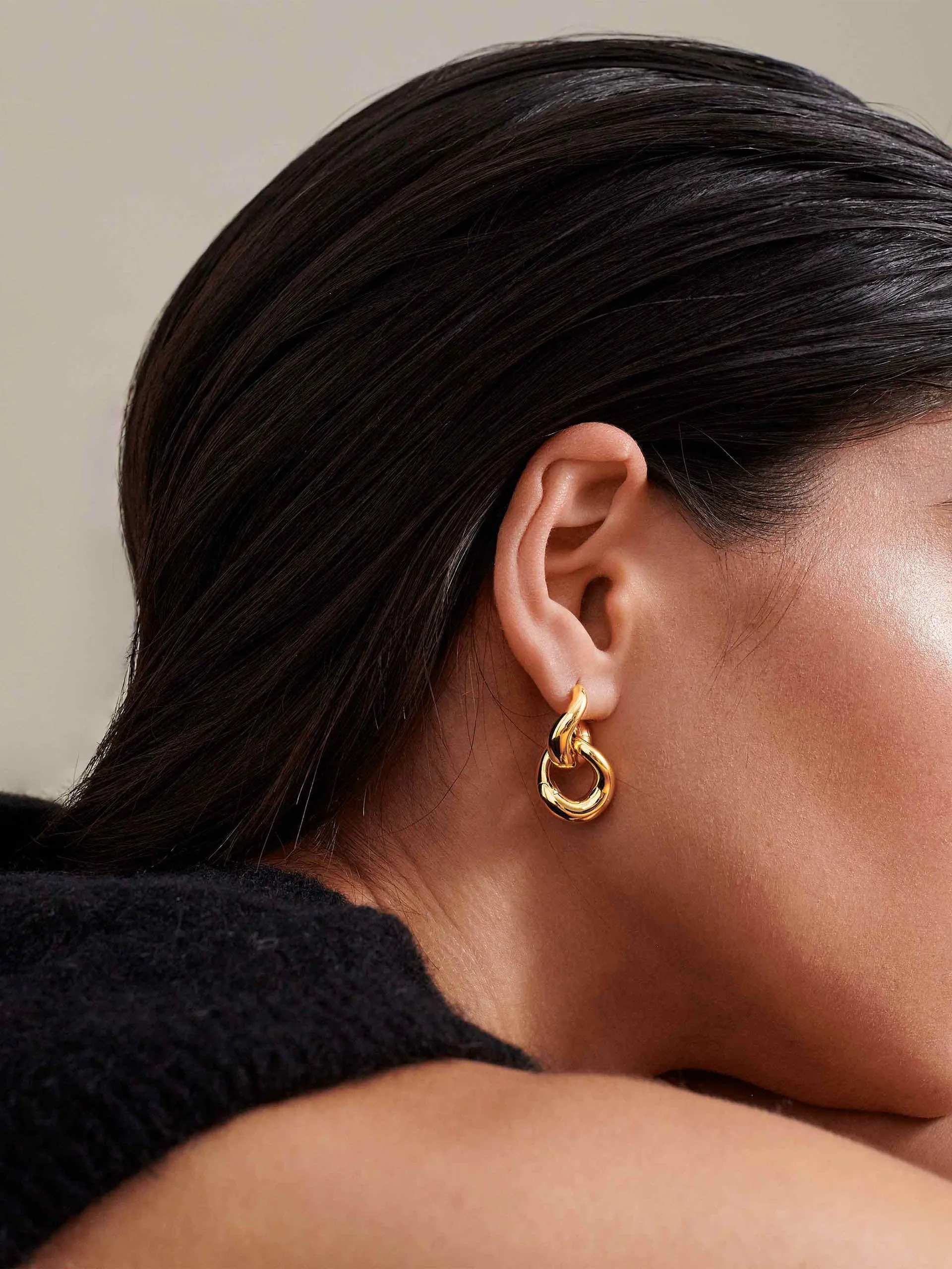 Charlotte Collins twist hoop earrings in gold