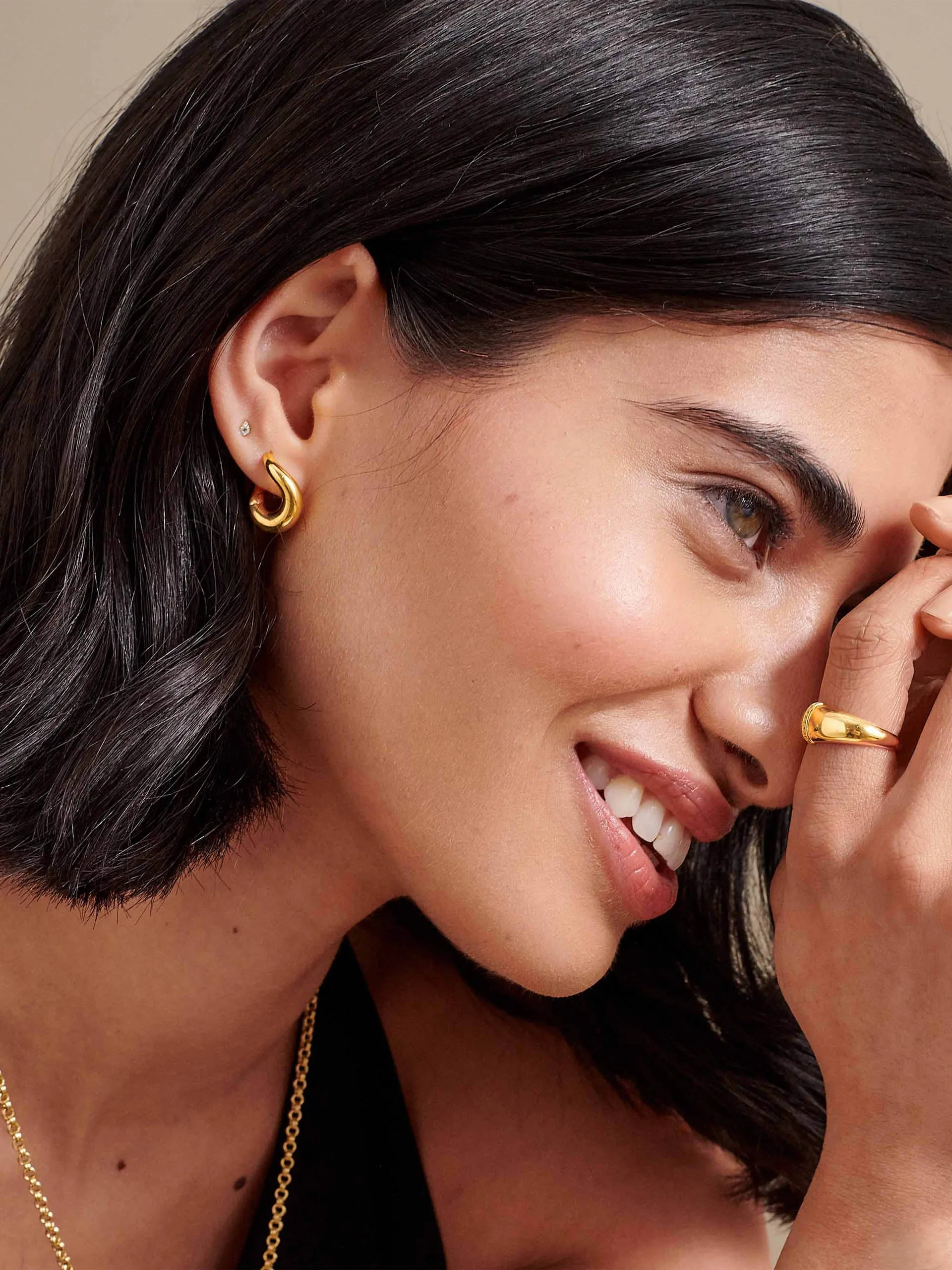 Charlotte Collins twist hoop earrings in gold