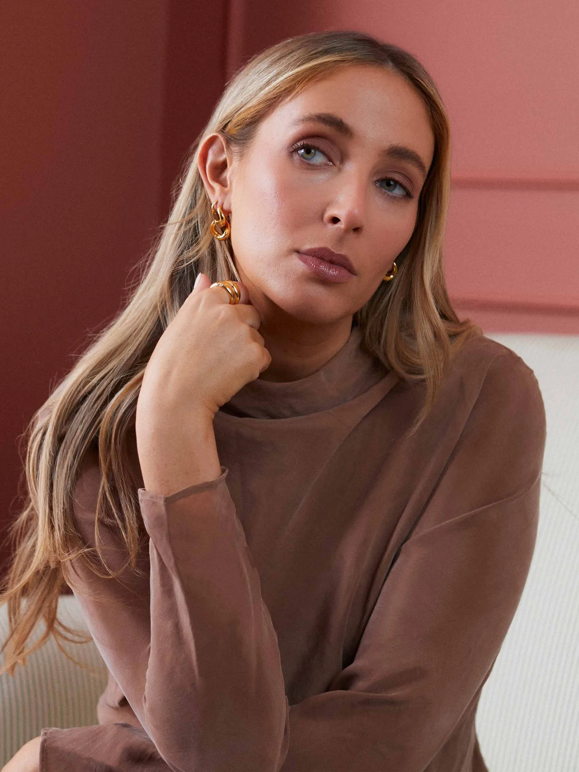Charlotte Collins twist hoop earrings in gold